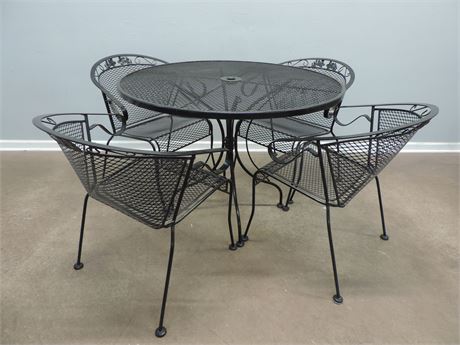 Patio / Sunroom Wrought Iron Table and Four Chairs.