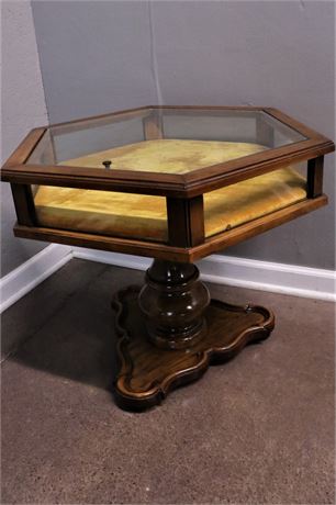 A Six Sided Glass Pedestal Treasure Table