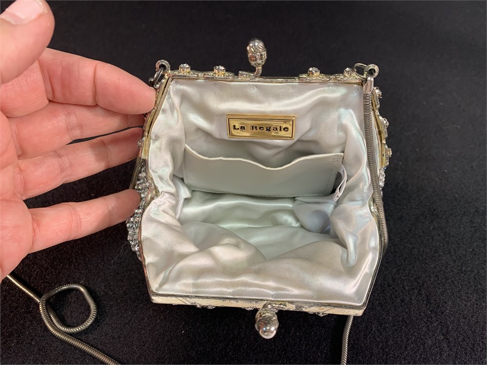 Sold at Auction: LA REGALE VINTAGE WHITE METALLIC PURSE WITH