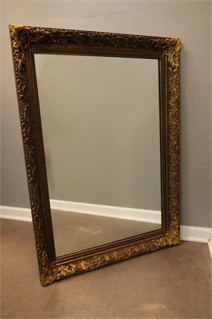Scroll Mirror in a Brassy Gold finish