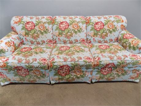 High End Couch with Bright Floral Design