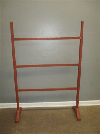 Early Red Painted "Shoe Foot" Mortised Quilt Rack