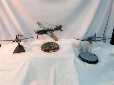 3 Fighter Model Airplanes F4U Corsair and 2 - P-40 Warhawks